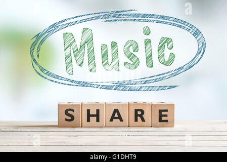 Music share sign on a wooden table Stock Photo