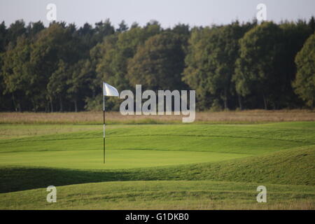 White flag on golf course. Stock Photo