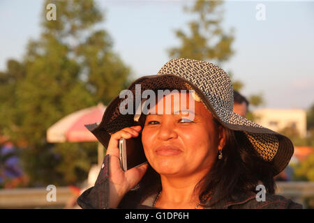 Woman using a mobile phone.  Vientiane. Laos. Stock Photo