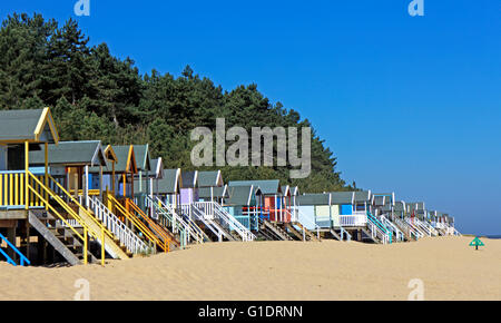 A view of beach huts in North Norfolk on the sands at Wells-Next-the-Sea, Norfolk, England, United Kingdom. Stock Photo