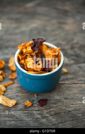 Vegetable chips in a blue bowlparty Stock Photo