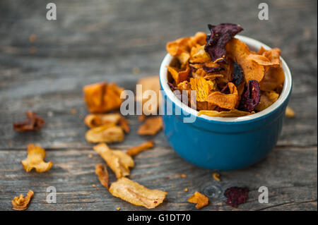 Vegetable chips in a blue bowlparty Stock Photo