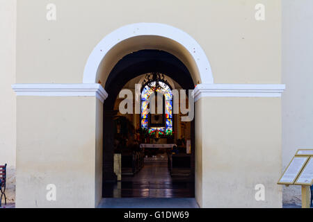 Misione de Nuestra Senora de Pilar (Our mission of the Lady of Pilar) entrance showing stained glass window in Todos Santos, Mex Stock Photo