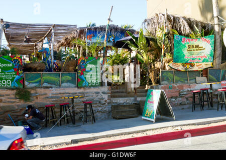 Outdoor cantina and restaurant seen from the street in Todos Santos, Baja, Mexico. Stock Photo