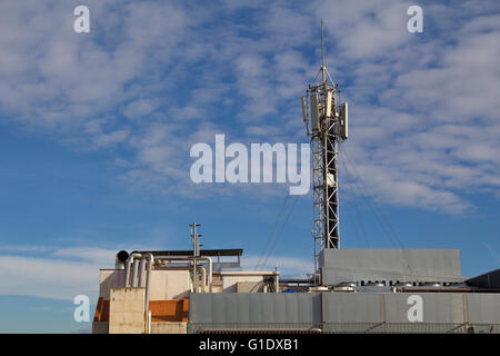 Mobile antenna in a roof top of a building Stock Photo