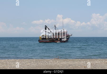 Purse seiner anchored off the beach in Central Philippines Stock Photo