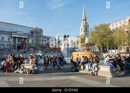 Crowds of people in Trafalgar Square in London's West End, London, England, U.K. Stock Photo