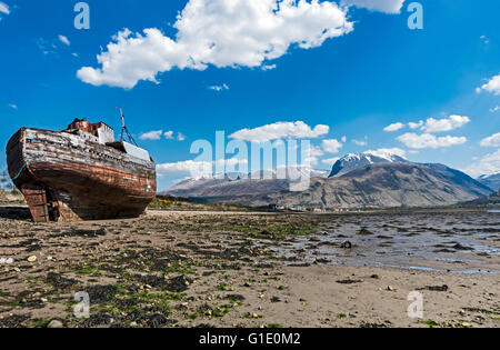 Shipwreck on the Loch Linnhe beach at Corpach with Ben Nevis & Fort William behind Stock Photo