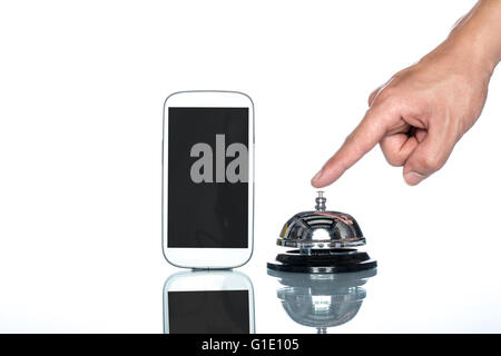 cell phone and Service bell with human hand on white background Stock Photo