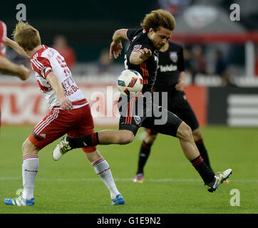 Washington, DC, USA. 13th May, 2016. 20160513 - D.C. United midfielder NICK DELEON (14) tries to move the ball past New York Red Bulls midfielder DAX MCCARTY (11) in the second half at RFK Stadium in Washington. Credit:  Chuck Myers/ZUMA Wire/Alamy Live News Stock Photo