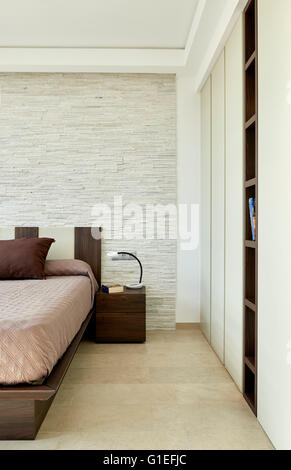 White House, L'Ametlla. partial view of a bedroom with neutral tones and minimal decoration. Stock Photo