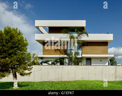 White House, L'Ametlla. Exterior view of modern house. Partially hidden by wall. Stock Photo