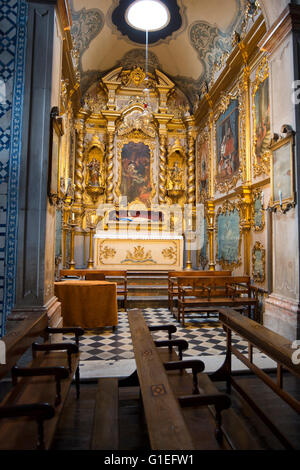 Santa Clara Convent Church in  Funchal, Madeira, Portugal. View of ornately decorations and rows of pews. Stock Photo