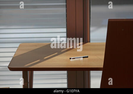 The New Library of Alexandria, Alexandria, Egypt. Close view of a table in the library. Pen on top of table. Stock Photo