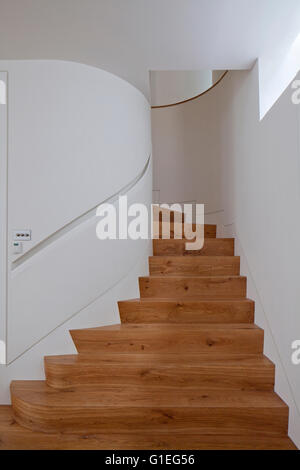 Modern Family home, Shepherds Bush, London. Spiral wood staircase and white walls. Stock Photo