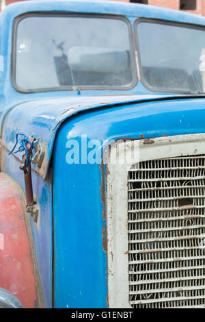 Vintage rusty red truck car with a old headlight Stock Photo
