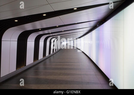 A pedestrian tunnel features an LED integrated lightwall and links St Pancras International and King's Cross St Pancras stations Stock Photo