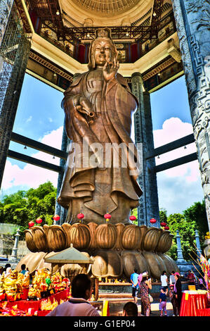 Statute of Guanyin (Kuan Yin), goddess of mercy, is made of brass and 99 feet tall. Chinese New Year celebrations at Kek Lok Si Stock Photo