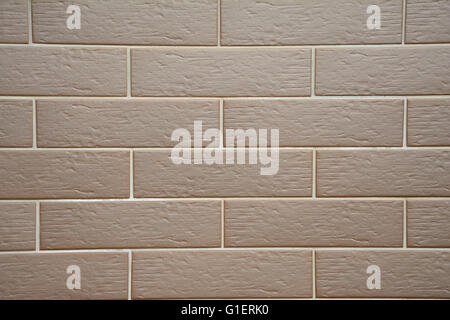 Brown clinker tiles on house wall - background. Stock Photo