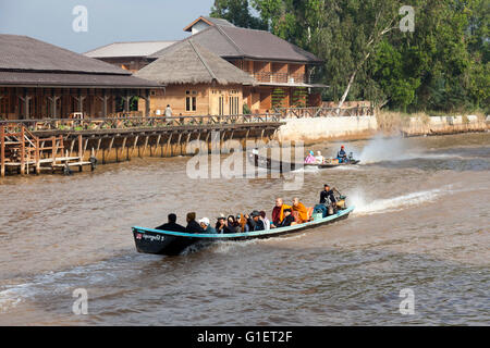 For tourists and locals the access to the Inle Lake from Nyaungshwe with motorized pirogues (Myanmar). Pirogues motorisées. Stock Photo