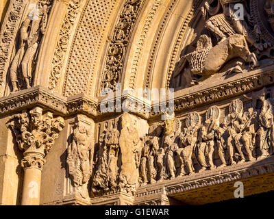 The tympanum of the great portal of the Saint-Fortunat church at the Benedictine abbey of Charlieu. Brionnais region Stock Photo