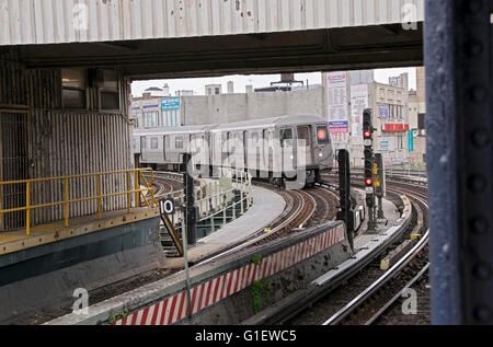 The B subway pulling into the Brighton Beach elevated subway station in Brooklyn, New York. Stock Photo