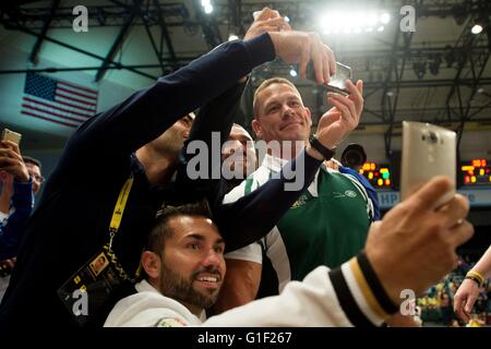 Spectators take selfies with WWE superstar John Cena during the 2016 Invictus Games at the ESPN Wide World of Sports Complex May 11, 2016 in Orlando, Florida. The Invictus Games are an international Paralympic-style multi-sport event, created by Prince Harry. Stock Photo