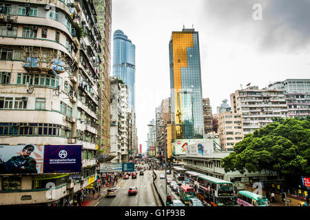 Hong Kong, China - April 1, 2012: A busy street in the heart of Mongkok, Hong Kong during the day Stock Photo