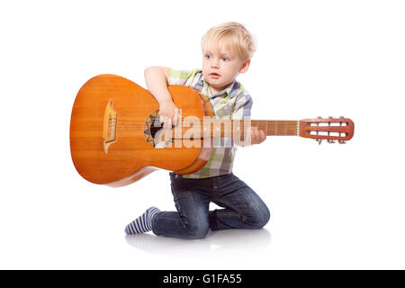 Cute boy with classical guitar. Isolated on white background Stock Photo