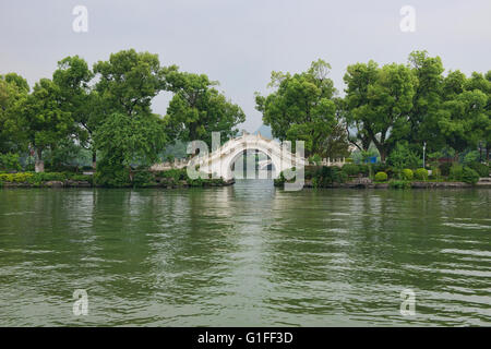 Traditional stone arch brdge on Banyan Lake, Guilin, Guangxi Autonomous Region, China Stock Photo