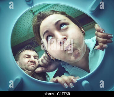 Woman ready to puke in the toilet bowl Stock Photo