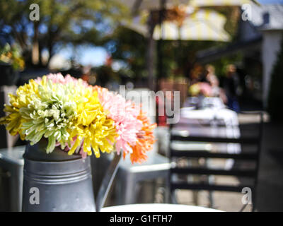 Fresh Flowers in a vase outside a cafe on Hahndorf Main street, Adelaide Hills, South Australia Stock Photo