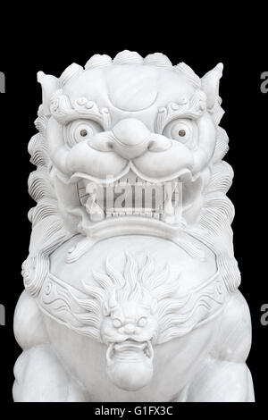 Chinese Imperial Lion statue isolated on black background. Stock Photo