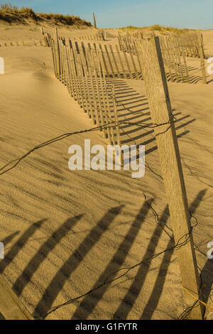 beach fencing in late afternoon Stock Photo