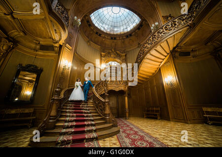 Old man coming down stairs Stock Photo picture