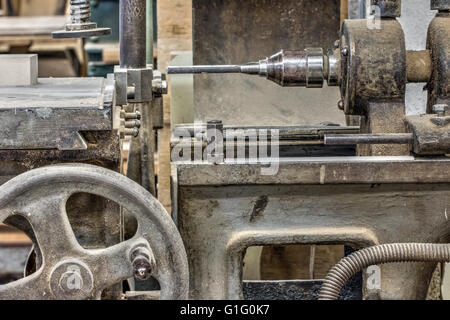 Old and used hole cutter in the carpentry workshop Stock Photo