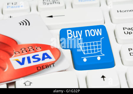 Shopping online. Online shopping button on a computer keyboard.with Visa debit card. Stock Photo