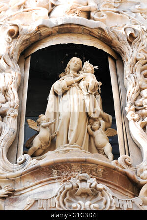 Architectural detail of alabaster sculpture depicting Virgin Mary on the front gate of Palacio del Marques in Valencia Stock Photo