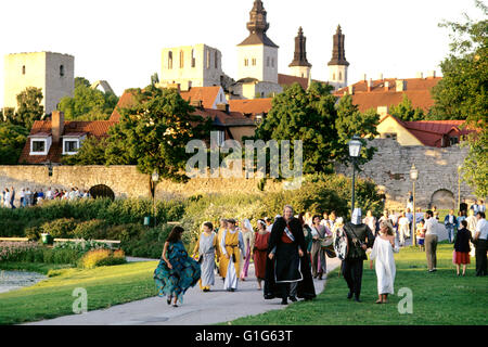 Medieval town from the south and dressed people on the way to the Medieval week Stock Photo