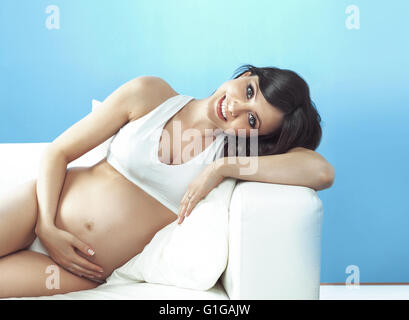 Portrait of the cheerful pregnant lady Stock Photo