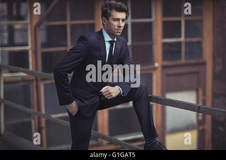 Elegant businessman wearing dark suit Stock Photo