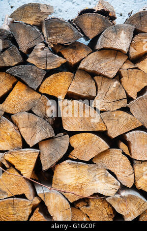 Background of dry chopped firewood logs in a pile Stock Photo