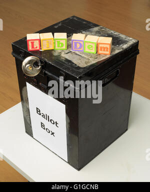 UK ballot box and childs' ABC blocks stating 'Lib Dem' in reference to British politics. Stock Photo