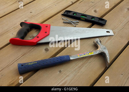 Carpentry tools on a wooden deck. Stock Photo