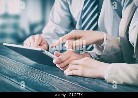 business meeting executive consulting review career report tablet - stock image Stock Photo