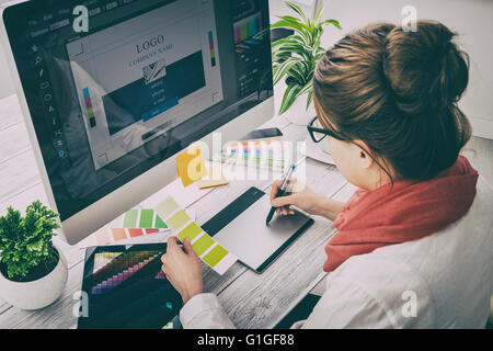 Graphic designer at work. Color swatch samples. Stock Photo