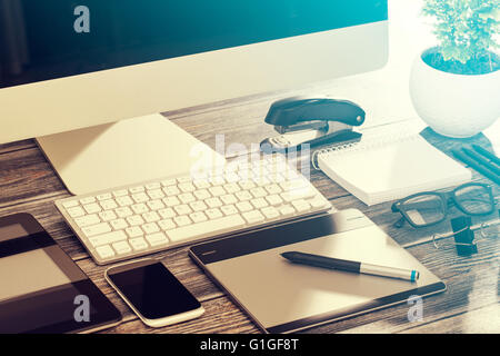Designer's desk with responsive design mockup concept. Stock Photo