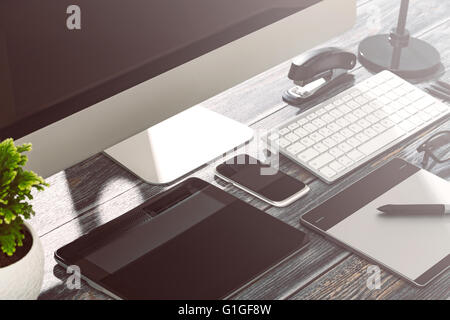 Designer's desk with responsive design mockup concept. Stock Photo