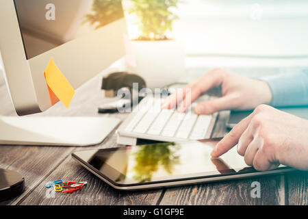 Designer hand working with digital tablet and computer. Stock Photo