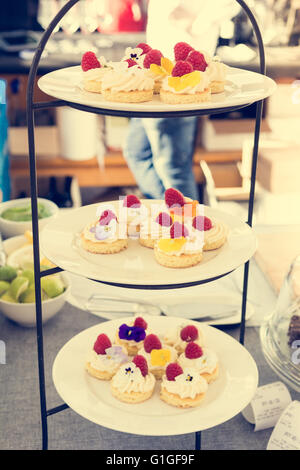 Tasty pastry decorated with flowers. Stock Photo